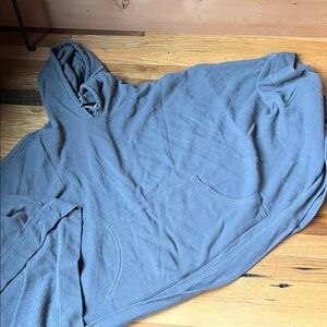 Shawl with hood and kangaroo pocket